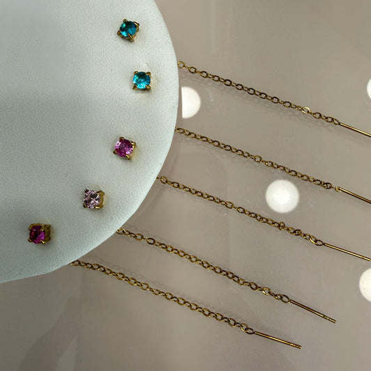 Orecchino punto luce con filo pendente